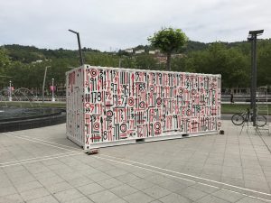 Side view of the container artwork with numbers beside the estuary
